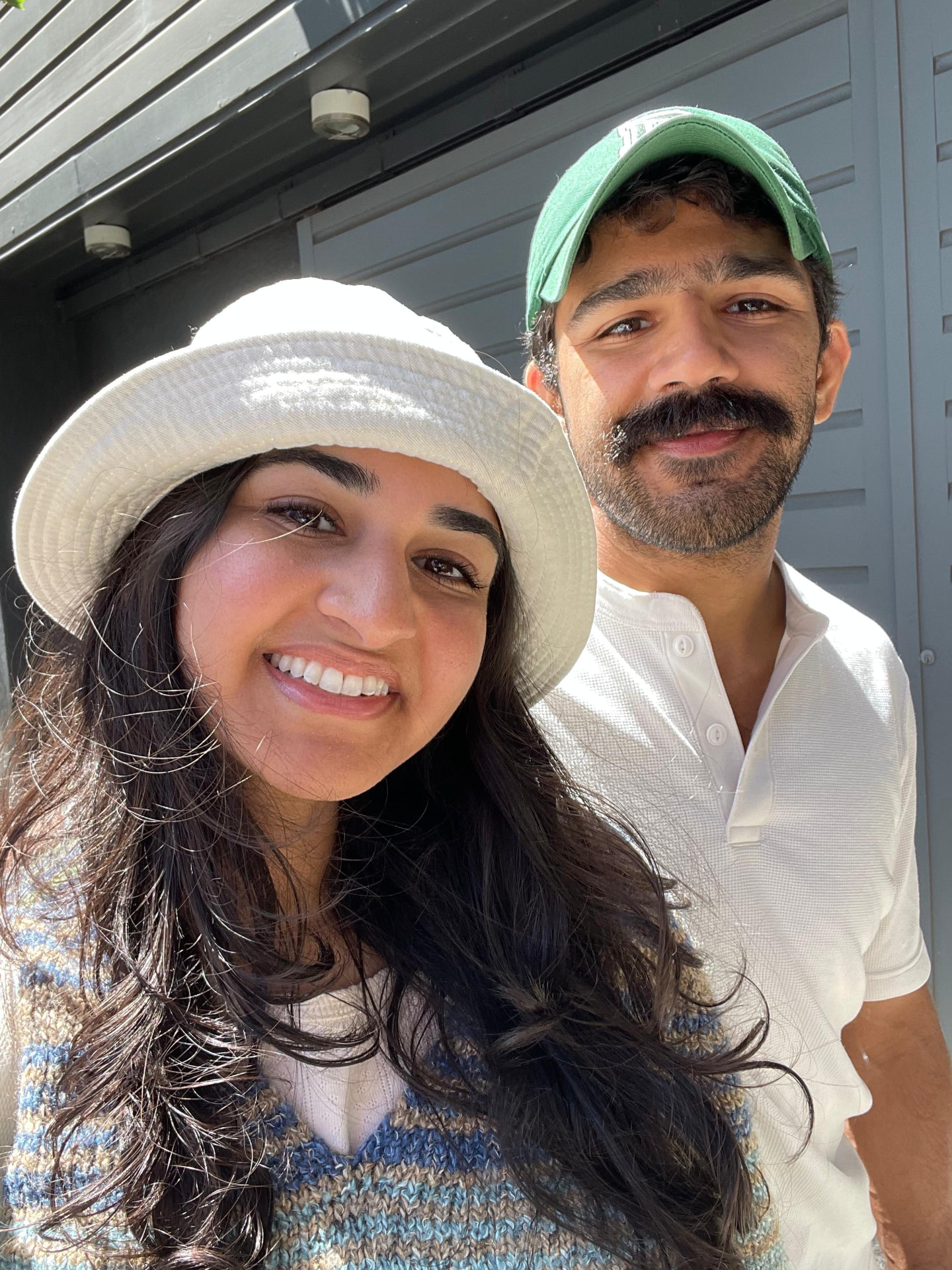 Sanjana with her husband on a sunny walk